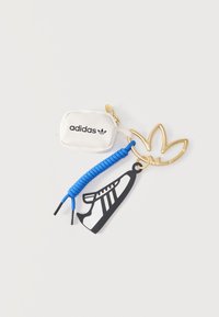 Geselecteerd, gold-coloured/semi lucid red/blue