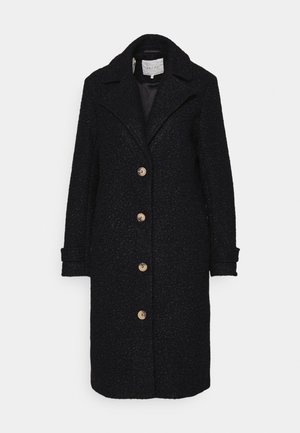 Black wool coat with a textured finish, single-breasted design, notched collar, and five large buttons. Long sleeves and knee-length cut.