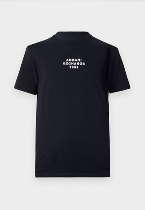 Black cotton t-shirt featuring a round neckline and short sleeves. White embroidered text reads "ARMANI EXCHANGE 1991" at the center.