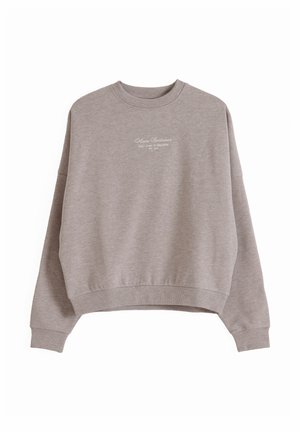 Světlě hnědá mikina s kulatým výstřihem, se žebrovanými manžetami a lemem, na prsou malý bílý nápis "Almond Sportswear".