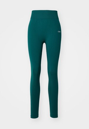 Teal aktive leggings med en bred elastik, fremstillet af strækbart stof. Har en glat tekstur og netdetaljer på den nederste del af benet.