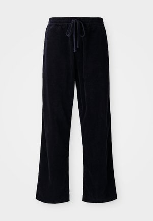 Black corduroy pants with a loose fit, featuring an elastic waistband and drawstring. Texture is ribbed and fabric appears soft.