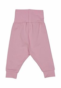 Pantalons en coton rose pour tout-petits, taille haute, design froncé et chevilles ressérées. Texture douce avec une couleur unie et simple.