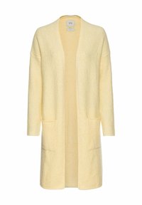 Lange, open voorkant cardigan van zacht, textuurachtig gele gebreide stof. Heeft twee voorzakken en een drop shoulder. Geen sluitingen.