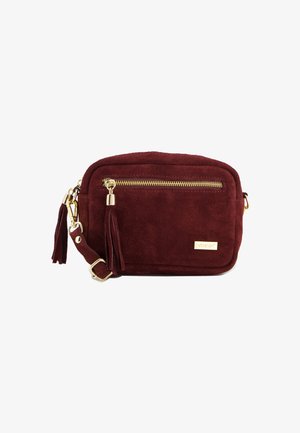 Burgundy suede crossbody bag with gold zipper, tassel pull, adjustable strap, and Venezia logo plaque on front pocket.