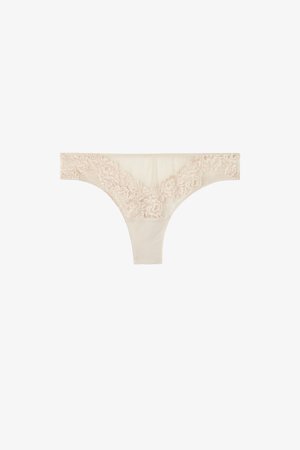 Beige trusse med blonder og blomsterprint, blødt stof og glat tekstur. Taljebåndet har detaljerede blondekanter for et ekstra design.