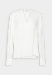 Weiße Bluse mit langen Ärmeln und V-Ausschnitt, aus glattem Stoff gefertigt. Verfügt über geknöpfte Manschetten und eine lockere Passform. Minimalistisches Design.