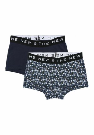 Flerfärgad blommönster och enfärgade navy boyshorts med svart elastiskt midjeband märkt "THE NEW" i vit text.