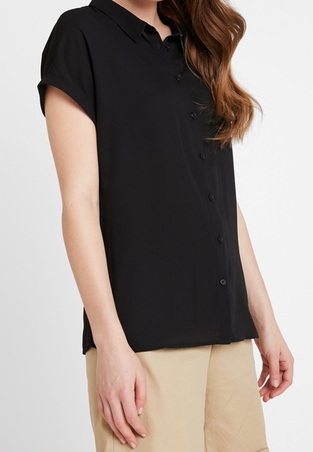 Black short-sleeve button-up shirt with a collar, made of smooth fabric. Features a relaxed fit and subtle buttons down the front.