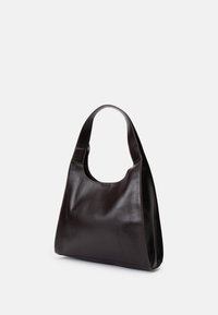 Dark brown leather handbag with a curved handle, soft texture, and a spacious, open design featuring a subtle seam detail.