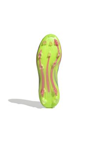 Soccer cleat sole in bright yellow with pink studs; features a textured surface and recessed logo; designed for traction and performance.