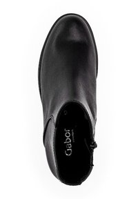 Botte de cheville en cuir noir avec bout arrondi, fermeture éclair sur le côté et marquage "Gabor Comfort" à l'intérieur de la chaussure.