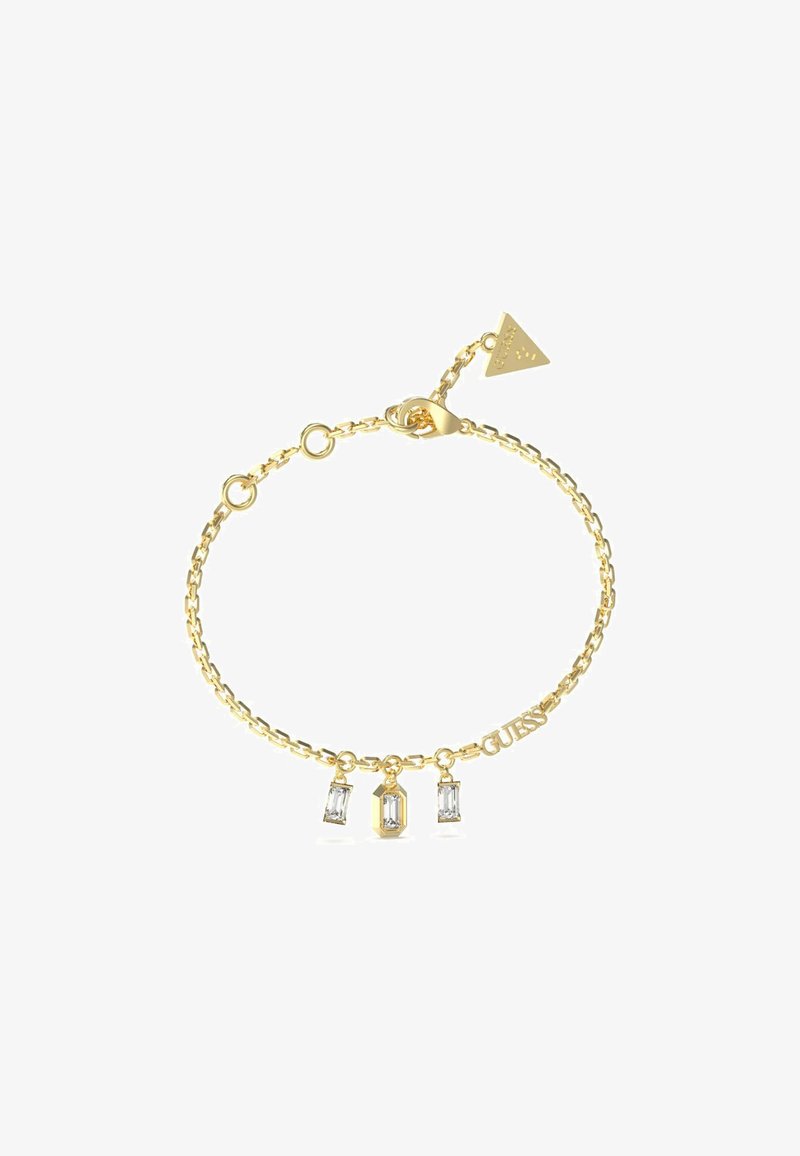 Bracciale in oro con tre ciondoli in cristallo trasparente e un'etichetta con marchio. Maglie semplici con chiusura a moschettone e lunghezza regolabile.