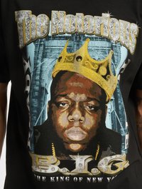 Black t-shirt featuring graphic print of a crown and a face, with text "The Notorious B.I.G" and "THE KING OF NEW YORK" in gold and silver colors.