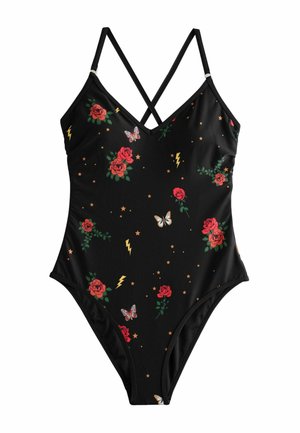 Schwarzer Einteiler mit Mustern aus roten Rosen, Schmetterlingen, Sternen und gelben Blitzsymbolen, mit dünnen, gekreuzten Schulterriemen.