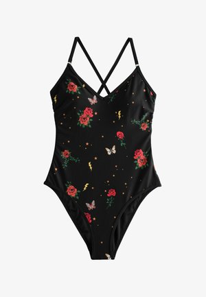 Black one-piece swimsuit with red rose, butterfly, star, and yellow lightning bolt patterns, featuring thin crossed shoulder straps.