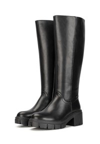 Black knee-high boots made of faux leather with a smooth texture, rounded toe, and a chunky platform sole featuring deep treads.