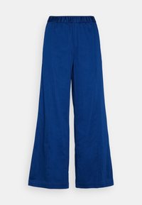 Modré široké kalhoty s elastickým pasem, vyrobené z měkké látky. Mají rovné švy a volný střih po celé délce nohavic.