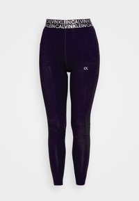 Schwarze Leggings mit hohem Bund, versehen mit einem kontrastierenden weißen "CALVIN KLEIN" Logo. Glatte Textur, figurbetontes Design mit einem subtilen Glanz.