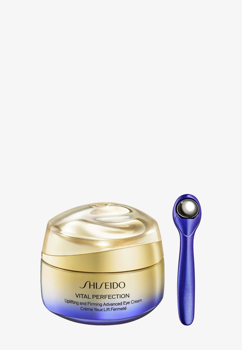 Shiseido Vital Perfection oogcrème in een ronde, gouden en blauwe pot met een gladde koepeldop. Inclusief een blauwe applicator met een zilveren bolpunt.
