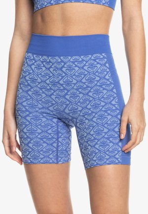 Shorts de bicicleta con patrón azul y cintura alta, que presentan un diseño geométrico en tonos de azul más claros y una textura de tela suave y elástica.