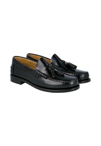 Mocasines de cuero negro con detalles cosidos y borlas decorativas, con un acabado liso y una suela de perfil bajo.