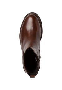 Brun läderankelboots med rund tå, sidodragkedja och dragflik sedd från ovan på vit bakgrund.