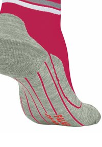 Sportowa skarpetka dziana w różowo-szarym kolorze. Posiada wyściełaną podeszwę, teksturowane wzory oraz wzór antypoślizgowy na spodzie, zapewniający przyczepność.