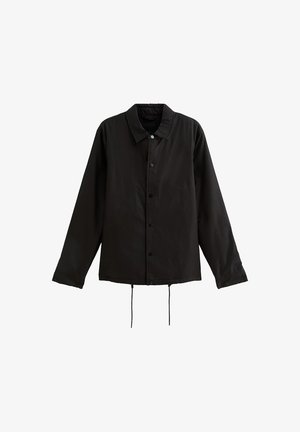 Giacca nera a maniche lunghe con bottoni, colletto e cordini regolabili all'orlo, esposta su uno sfondo bianco.