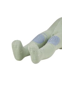 Grüne, weiche Stoffleggings mit strukturierten blauen Knieflicken. Die Sohlen verfügen über ein gepunktetes Anti-Rutsch-Muster für besseren Halt und Stabilität.