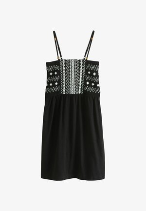 Czarna sukienka bez rękawów z cienkimi regulowanymi ramiączkami i białymi geometrycznymi haftowanymi wzorami na gorsecie.