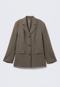 Bruine visgraatblazer met notch-lapels, sluiting met drie knopen, twee voorkanten zakken en rafelige randen. Gemaakt van een katoen-wolmix.