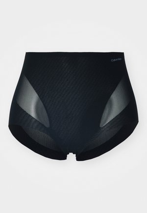 Calvin Klein svarta high-waisted trosor med en texturerad matt yta, genomskinliga meshpaneler och utan synlig hårdvara eller dekorationer.