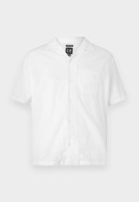 White short-sleeve shirt made of lightweight fabric, featuring a button front, pointed collar, and a chest pocket. Minimalist design.