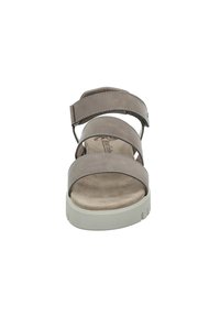 Brown suede sandals featuring three wide straps and a cushioned footbed. The sole is light-colored with a textured grip.