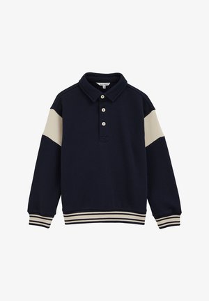 Suéter azul marino con cuello tipo polo, detalles en color crema en las mangas, tapeta de tres botones y dobladillo y puños de canalé a rayas. Textura de tela suave.