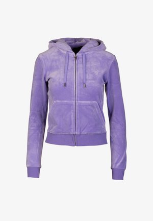 Purple zip-up hoodie with a soft, textured finish, featuring a hood, front pockets, and ribbed cuffs and hem. Logo on the chest.