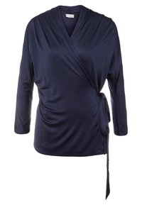 Námořnický zavinovací top s dlouhými rukávy, vyrobený z hladkého materiálu. Disponuje výstřihem do V, bočním zavázáním a nabíranými detaily na boku pro přiléhavý vzhled.