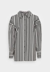 Chemise boutonnée avec un col évasé, présentant des rayures verticales noires et blanches, des manches longues et des poignets discrets avec des accents rayés.