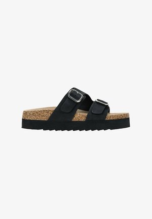 Sandalias de ante negro con dos correas ajustables y hebillas de plata. Plantilla de corcho y suela de goma negra texturizada. Diseño plano.