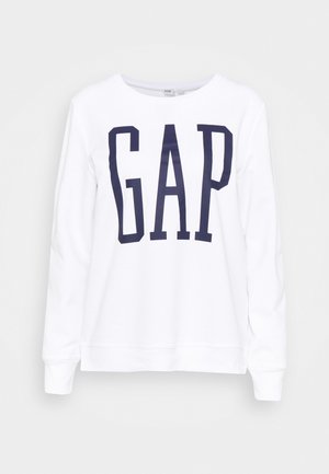 Witte sweatshirt met lange mouwen, met een groot marineblauw "GAP" logo op de voorkant, ronde halslijn en geribbelde boorden aan mouwen en zoom. Zachte stoftextuur.