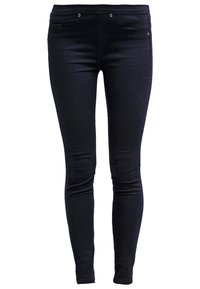 Kapeat farkut tummansinisestä denimestä, joissa on sileä pinta, viiden taskun malli ja metalliset yksityiskohdat.