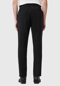 Black trousers with a straight-leg design, made of soft fabric, featuring a smooth texture, belt loops, and two back pockets.