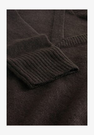 Dark brown wool sweater featuring a V-neck, ribbed cuffs, and a soft, textured surface. Focus on fabric details and knit pattern.