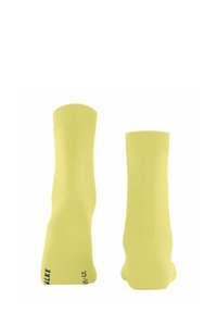 Neonowe żółte bawełniane skarpetki z prążkowanym ściągaczem i wyściełanym spodem, z nadrukowanymi szczegółami rozmiaru na czarno przy kostce.