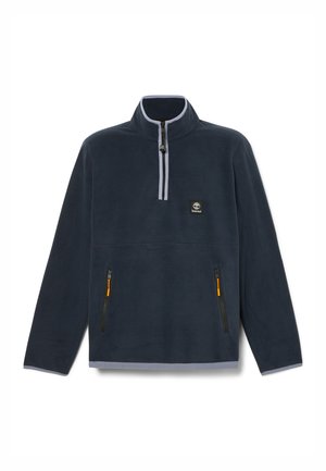 Navy fleece pullover with a half-zip collar, gray trim, and two zippered pockets with orange accents. Timberland logo on the left chest.