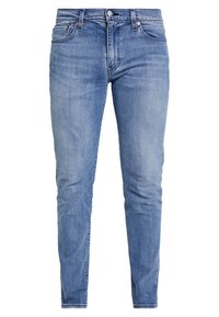 Modré džíny z denimu s úzkým střihem, klasickým pětipaketovým designem, jemným vyblednutím a měděnými nýty na pásu.