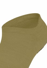 Zielona skarpetka sięgająca kostki o teksturowanej powierzchni, z niskim krojem i elastycznym wykończeniem. Bezszwowa konstrukcja z wzmocnioną częścią palców.