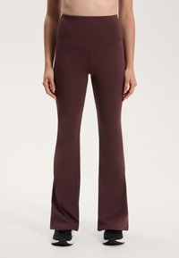 Bordó, harang szabású leggings magas derékkal, sima, rugalmas anyagból készült, letisztult dizájnnal és minimális varrással.
