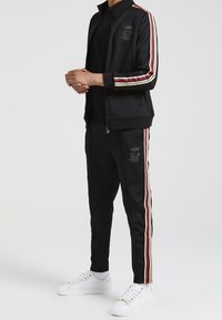 SIKSILK Pantalones deportivos - black